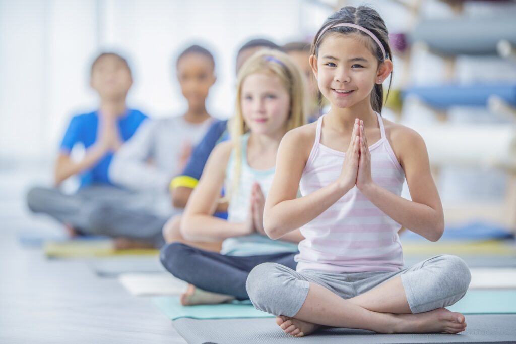 Montessori school children learning yoga in Houston TX